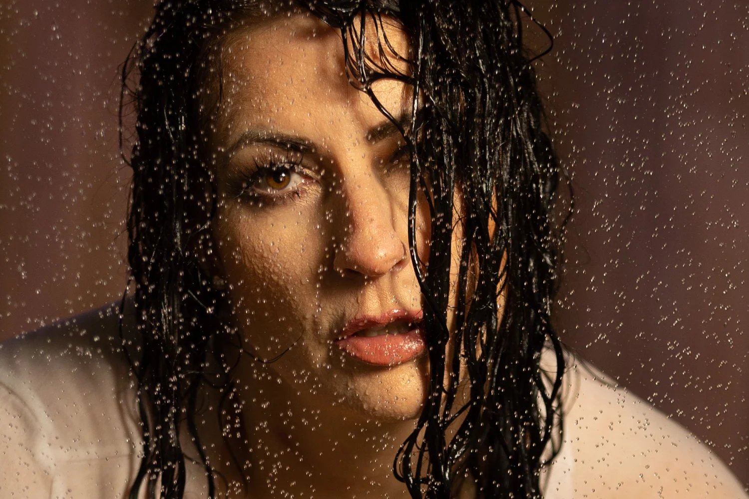 woman in the rain with a come hither look